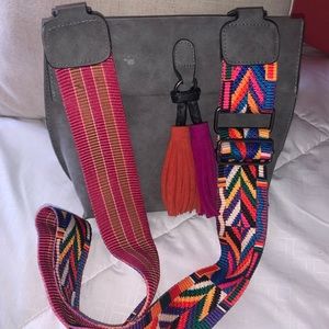 Gray bag with multi color strap